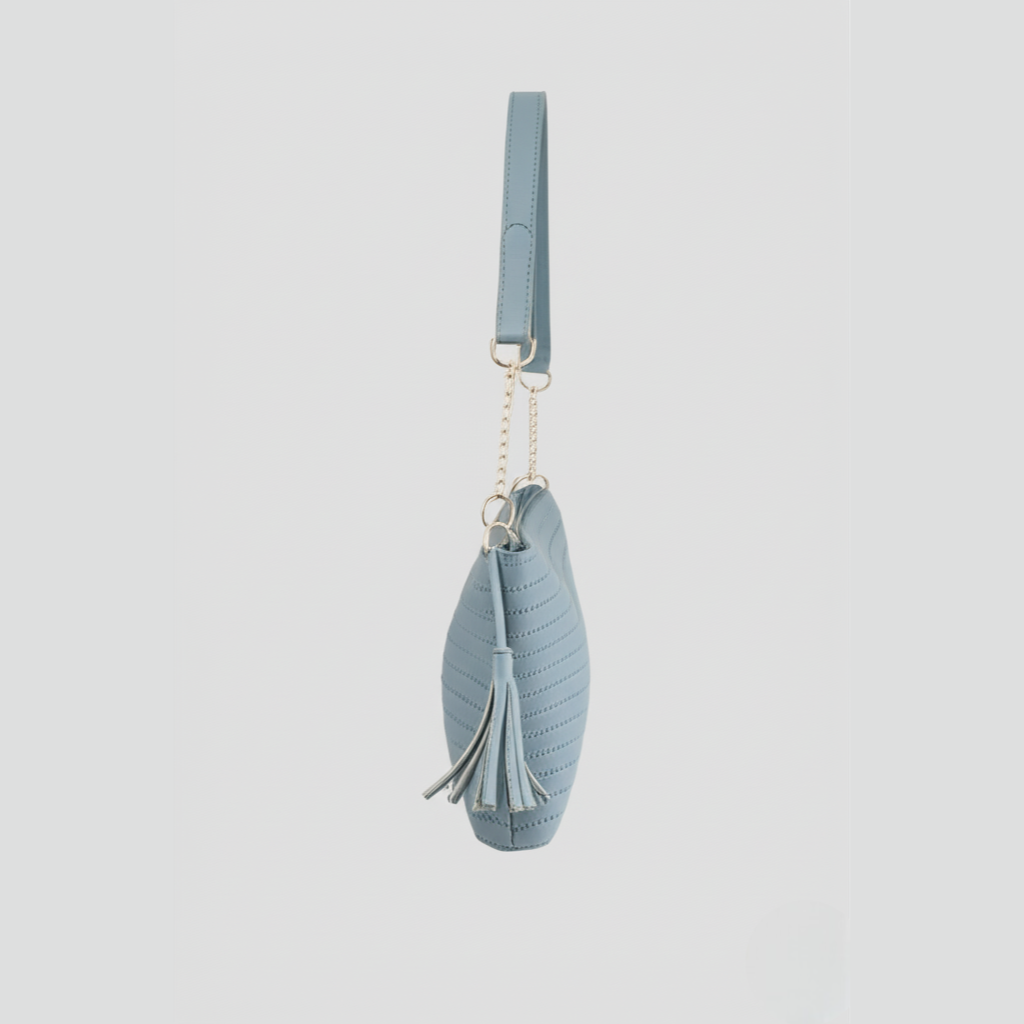 "Sky Blue Quilted Shoulder Bag with Tassel Accents"